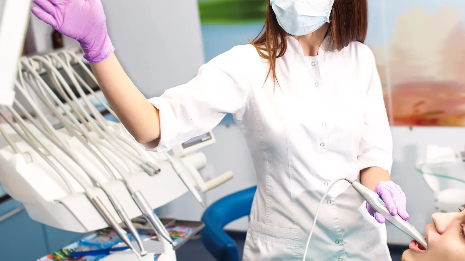 A clinician preparing a treatment room