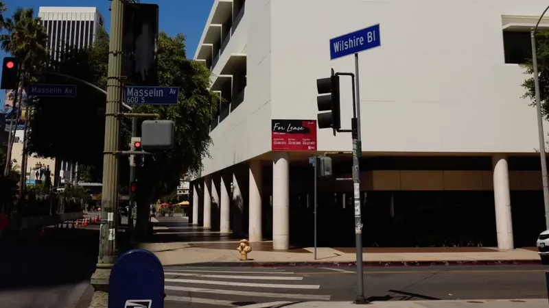 The corner of Wilshire Boulevard and Masselin Avenue outside the building